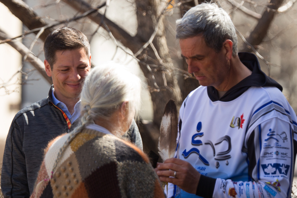 Joe receiving Feather with Winnipeg Mayor in Background